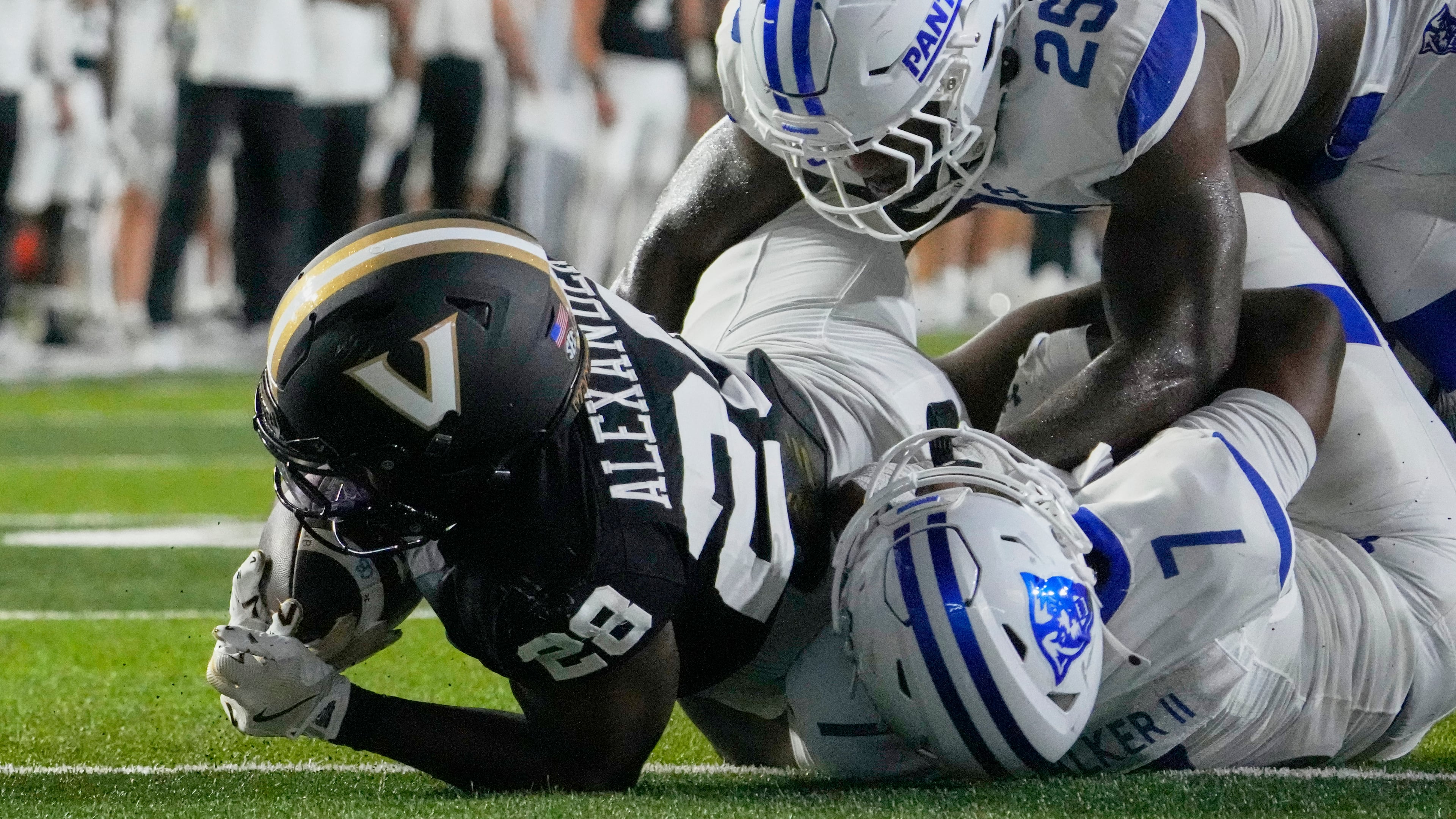 Vanderbilt running back Sedrick Alexander (28) scores a touchdown past Georgia State safety Deuce Walker (7) and linebacker Josiah Robinson (25) during the first half of an NCAA college football game Saturday, Sept. 20, 2025, in Nashville, Tenn. (George Walker IV/AP)