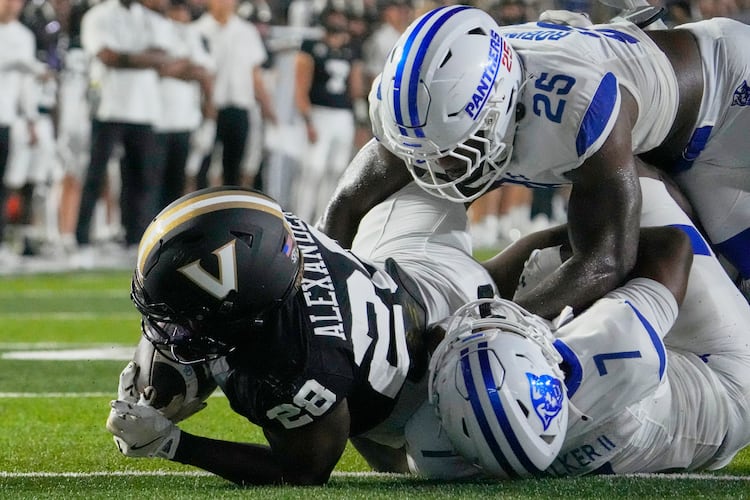Vanderbilt running back Sedrick Alexander (28) scores a touchdown past Georgia State safety Deuce Walker (7) and linebacker Josiah Robinson (25) during the first half of an NCAA college football game Saturday, Sept. 20, 2025, in Nashville, Tenn. (George Walker IV/AP)