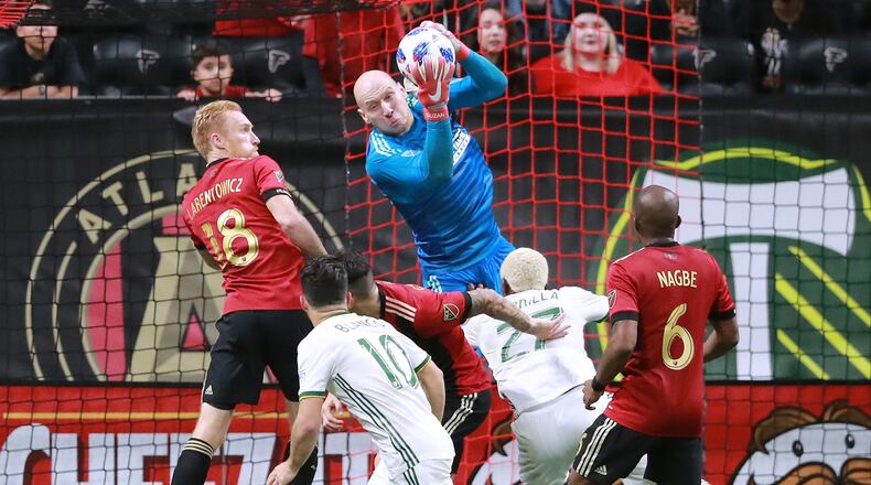 Dec 8, 2018 Atlanta: Atlanta United goalkeeper Brad Guzan blocks a shot on goal by the Portland Timbers on the way to winning the MLS CUP 2-0 on Saturday, Dec 8, 2018, in Atlanta. Curtis Compton/ccompton@ajc.com
