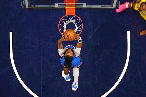 Oklahoma City Thunder guard Isaiah Joe dunks against the Indiana Pacers during the second half of Game 6 of the NBA Finals basketball series, Thursday, June 19, 2025, in Indianapolis. (Maddie Meyer/Pool Photo via AP)