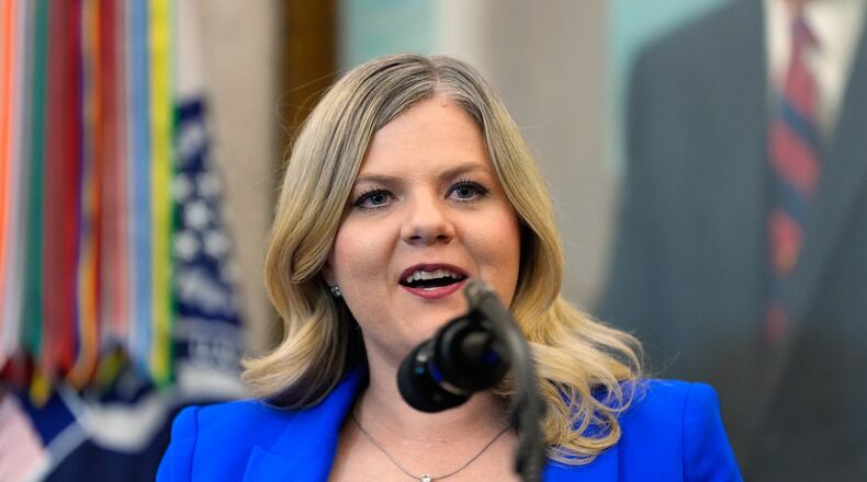 FILE - Dr. Heidi Overton, Deputy Director of the White House Domestic Policy Council, speaks about IVF during an event in the Oval Office of the White House with President Donald Trump, Oct. 16, 2025, in Washington. (AP Photo/Alex Brandon, File)