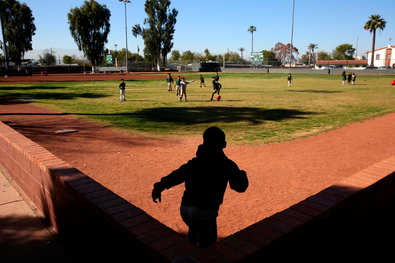 FILE- Students play ball during recess at the St. Agnes Elementary School in Phoenix, Ariz., on March 3, 2020. (AP Photo/Dario Lopez-MIlls, File)