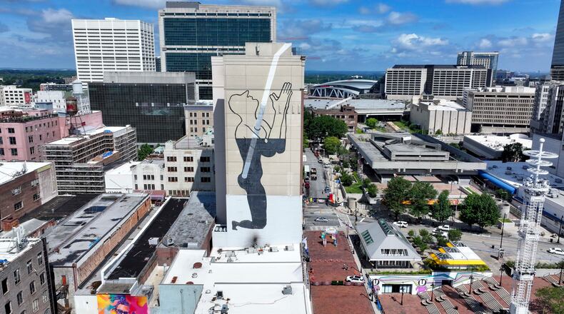 An aerial image shows a large mural on the east side of the Connally Hotel, on Peachtree Street in downtown. The mural's meaning has puzzled passersby for more than a decade.
(Miguel Martinez/AJC)