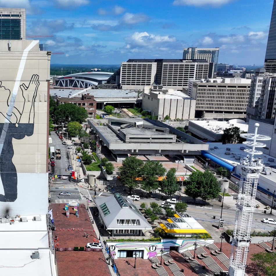 An aerial image shows a large mural on the east side of the Connally Hotel, on Peachtree Street in downtown. The mural's meaning has puzzled passersby for more than a decade.
(Miguel Martinez/AJC)
