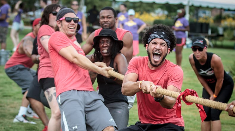 Tristan Shonfelt  celebrates after his team wins the tug of war contest during Atlanta Field Day in Atlanta last year. Kids and families can participate in tug of war and other outdoor events at a free family field day Saturday in Gwinnett.
