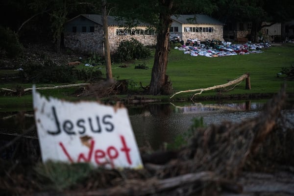 FILE - Camper's belongings sit outside one of Camp Mystic's cabins near the Guadalupe River after a flash flood swept through the area Monday, July 7, 2025, in Hunt, Texas. (AP Photo/Eli Hartman, File)