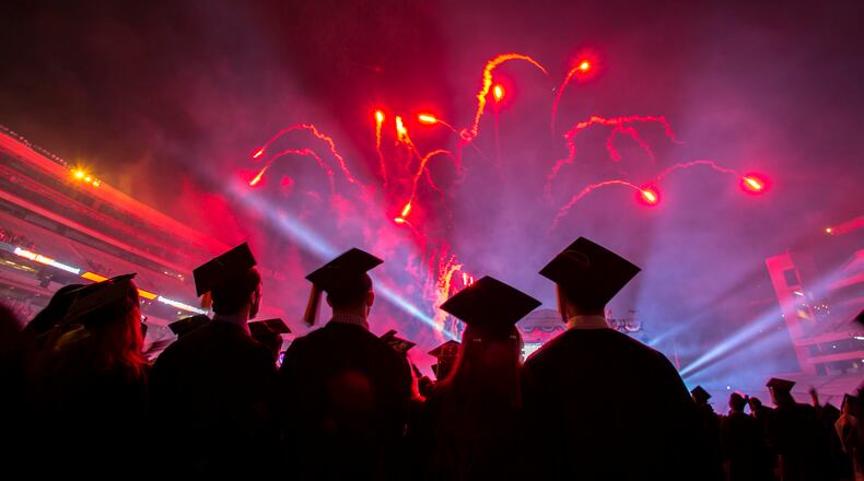 Students watch the fireworks and light show at the end of the 2015 undergraduate commencement ceremony. (Handout photo)