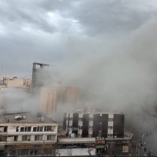 Smoke engulfs a street after a strike in Tehran, Iran, Monday, March 2, 2026. (AP Photo/Mohsen Ganji)