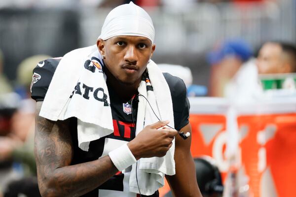 Falcons quarterback Michael Penix Jr. leaves the field with an injury at Mercedes-Benz Stadium on Sunday, Nov. 16, 2025, in Atlanta. Penix likely won’t be ready to play for next season’s opener, putting the Falcons’ decision-makers in a spot. (Miguel Martinez/AJC)