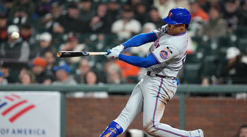 New York Mets' Juan Soto hits a single during the eighth inning of a baseball game against the San Francisco Giants in San Francisco, Thursday, April 2, 2026. (AP Photo/Tony Avelar)
