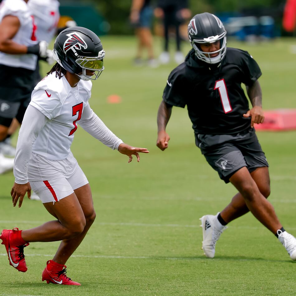 Falcons running back Bijan Robinson (left) and quarterback Tua Tagovailoa participate in practice on Monday, June 8, 2026, in Flowery Branch. Tagovailoa’s accuracy has long been his calling card, and it was on full display this summer. (Erik S. Lesser for the AJC)