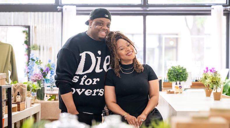Aaron and Ty Jenkins, owners of Olive Branch in downtown Decatur, pose for a portrait in the middle of their store on Tuesday, April 29, 2025. (Bita Honarvar for the AJC)