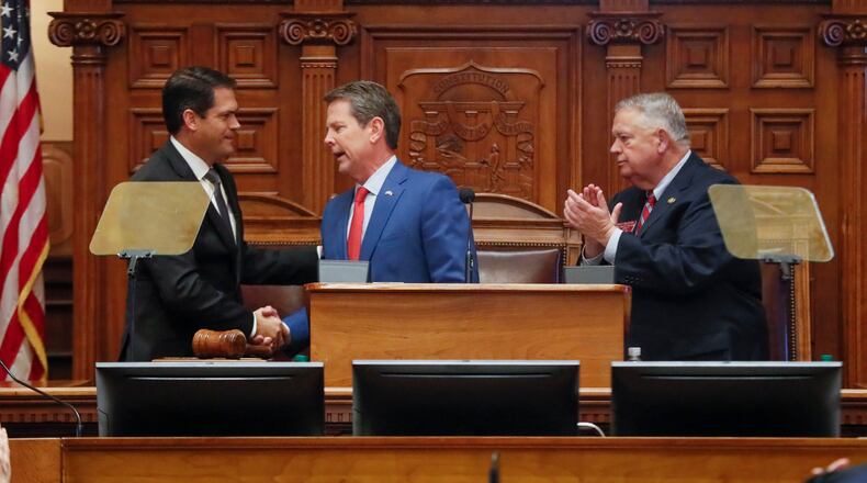 January 16, 2020 - Atlanta - Gov. Brian Kemp shook hands with Lt. Gov. Geoff Duncan (left) and House Speaker David Ralston after he delivered his second State of the State address as the Georgia 2020 General Assembly continued for it's fourth legislative day. The governor and the house honored former U.S. Senator Johnny Isakson during the session. Bob Andres / bandres@ajc.com