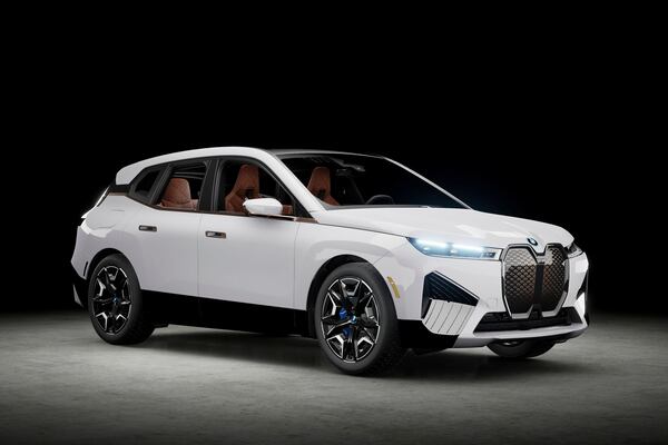 This photo provided by BMW shows the 2022 BMW iX, considered an outstanding used car bargain if you're looking for an electric luxury SUV. (Courtesy of BMW of North America via AP)