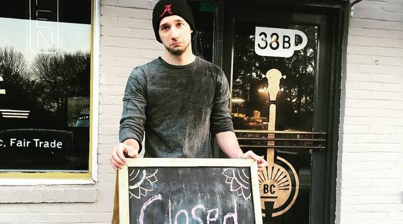 Benjamin Mitchell, a barista at Banjo Coffee, shows the sad face that customers experienced Wednesday and Thursday when the Avondale shop was temporarily closed, due to DeKalb County’s “boil water” advisory. On Friday Banjo reopened, with water “imported” from Fulton County. Photo: courtesy Banjo Coffee