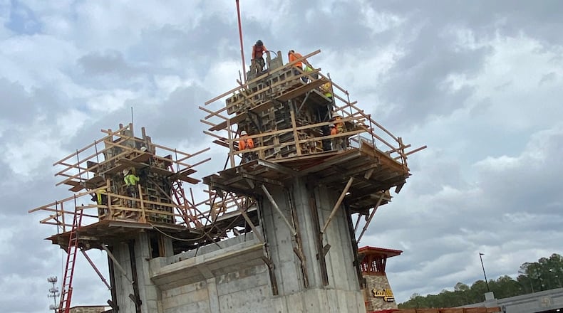 Drivers on Peachtree Parkway/Ga. 141 in Peachtree Corners can’t miss construction now underway on the city’s soon to be iconic pedestrian bridge. (Photo credit Karen Huppertz)