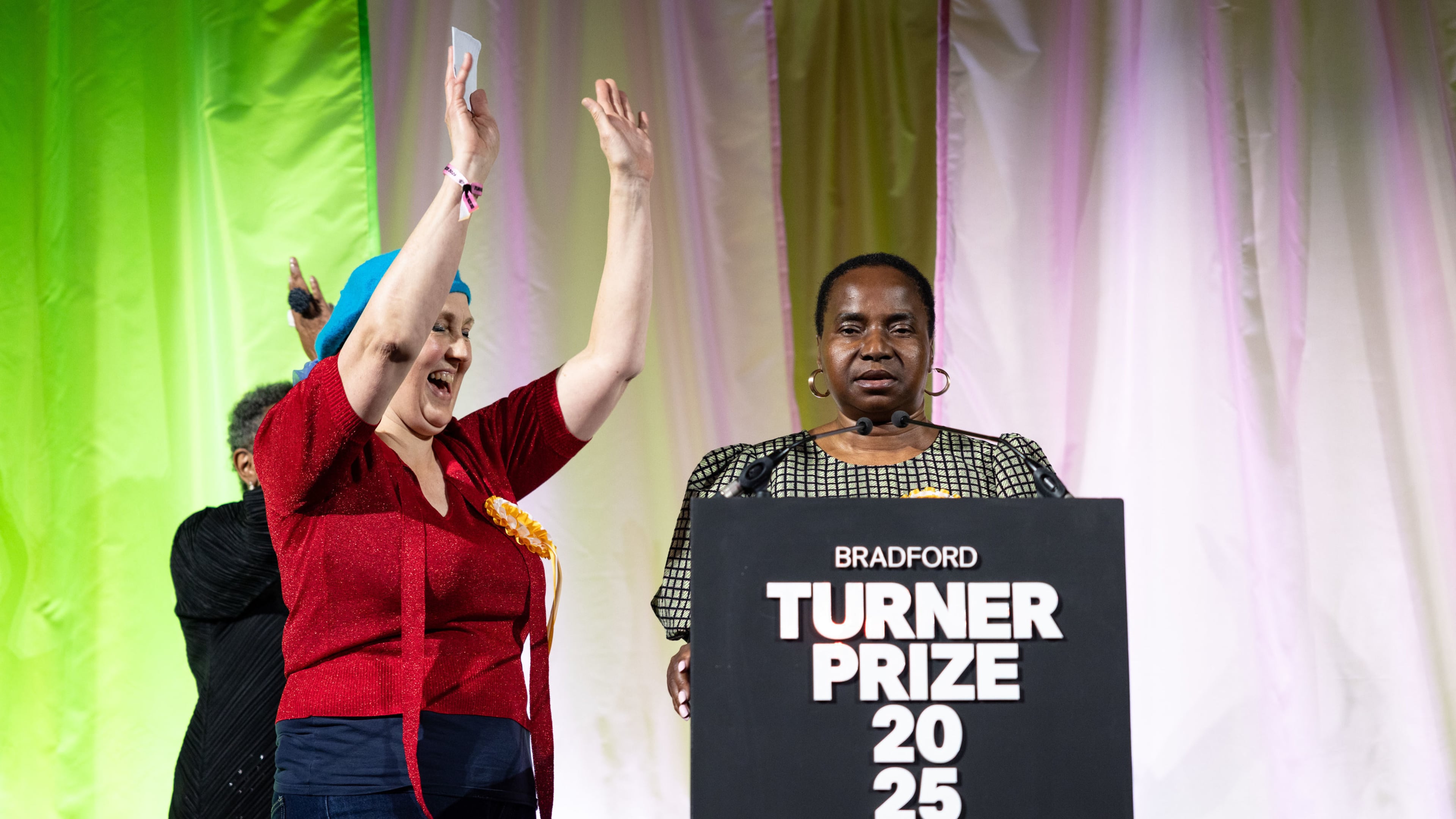 Nnena Kalu, right, is announced as the winner of the Turner Prize 2025 at a ceremony at Bradford Grammar School, in Bradford, England, Tuesday Dec. 9, 2025. (James Speakman/PA via AP)