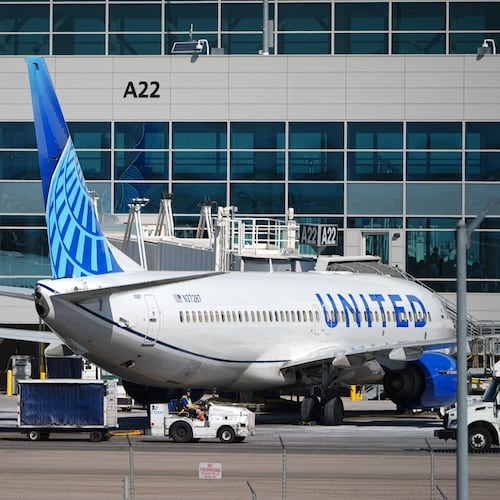 FILE - A United Airlines jetliner sits at a gate along the A concourse of Denver International Airport, March 20, 2026, in Denver. (AP Photo/David Zalubowski, File)