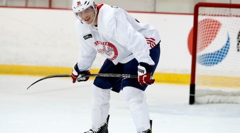 Washington Capitals' Alex Chiasson, left, pauses during practice at their NHL hockey practice facility, Friday, Sept. 15, 2017 in Arlington, Va. (AP Photo/Alex Brandon)