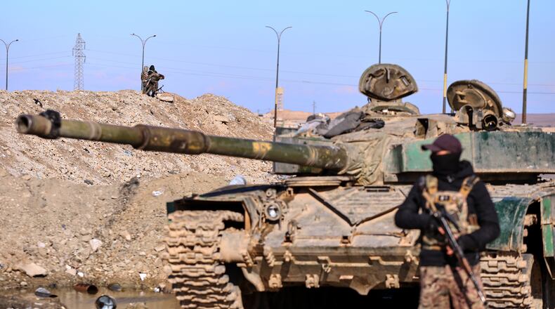 Soldiers of the Kurdish-led, U.S.-backed Syrian Democratic Forces (SDF) deploy with armoured military vehicles to secure roads leading to Gweiran Prison which houses men accused of being an Islamic State (ISIS) fighters in Hassakeh, northeastern Syria, Monday, Jan. 19, 2026. (AP Photo/Baderkhan Ahmad)