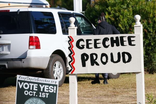 Signs posted in front of a multi-purpose center on Georgia's Sapelo Island on Tuesday, October 22, 2024. (Miguel Martinez / AJC)