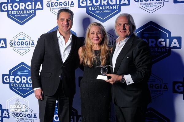 Niko Karatassos (left), Anne Symbas (center) and Pano I. Karatassos (right) attended the Georgia Restaurant Association Crystal of Excellence Awards to represent their father, I. Pano Karatassos of Buckhead Life Group, during his induction into the hall of fame. (Courtesy of Georgia Restaurant Association)