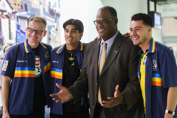 Matthew Plese, Omar Yousaf and Joabe Barbosa celebrate with MARTA CEO Jonathan Hunt after setting a Guinness World Record for the fastest time visiting every single MARTA station in Atlanta on Thursday, Jan. 8, 2026. The group set the record at three hours and 21 minutes. (Abbey Cutrer/AJC)