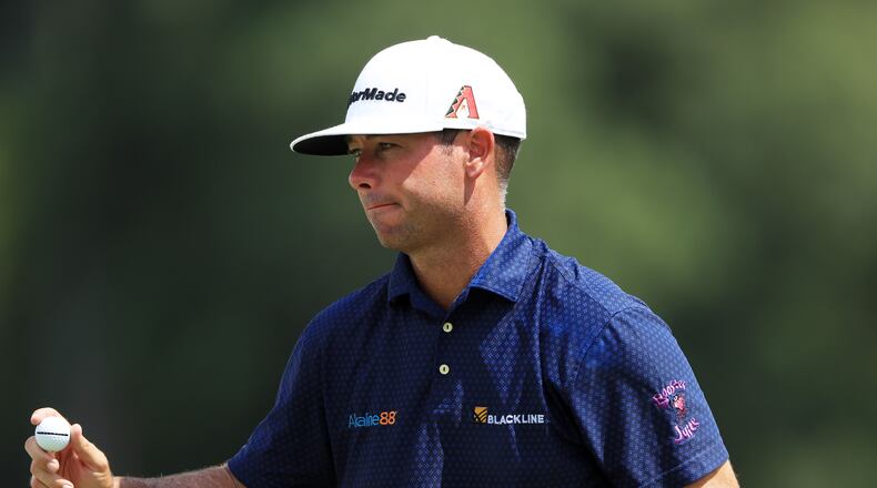 It's a satisfying day all around for Chez Reavie, who shot 64, the low round of Friday at East Lake. (Photo by Sam Greenwood/Getty Images)