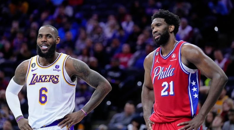 Los Angeles Lakers' LeBron James and Philadelphia 76ers' Joel Embiid play during an NBA basketball game, Friday, Dec. 9, 2022, in Philadelphia. (AP Photo/Matt Slocum, File)
