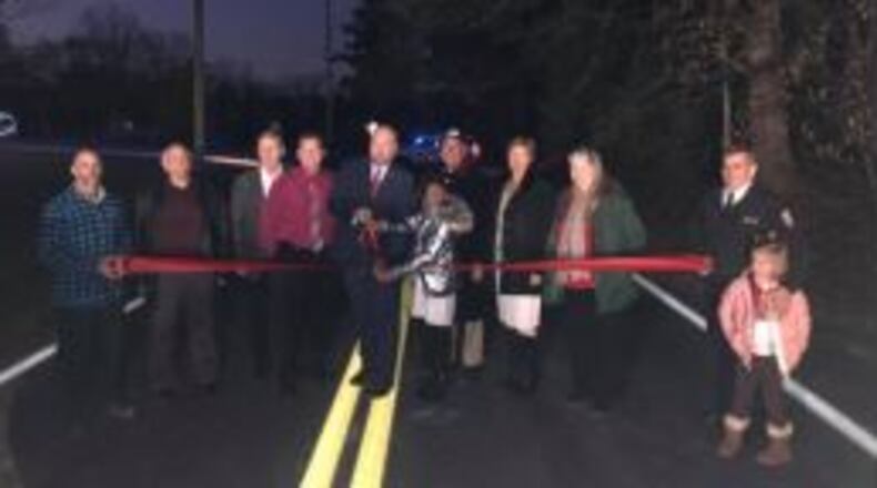 From left to right: Public Works Director Darold Wendlandt, TSPLOST Committee Representative Bob Shelor, Councilmember Don Hayes, Councilmmebr Richie Schmidt, Mayor Tom Reed, “Mayor for a Day” Keioyana Edwards, Coucilmember Elect Alan Merrill, Mayor Pro Tem Faye Godwin, Coucilment Claire Wiliams, Fire Chief Greg Brett, and Cloe Brett celebrate completion of TSPLOST project. CONTRIBUTED