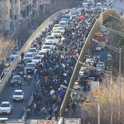 FILE - Protesters march on a bridge in Tehran, Iran, on Dec. 29, 2025. (Fars News Agency via AP, File)