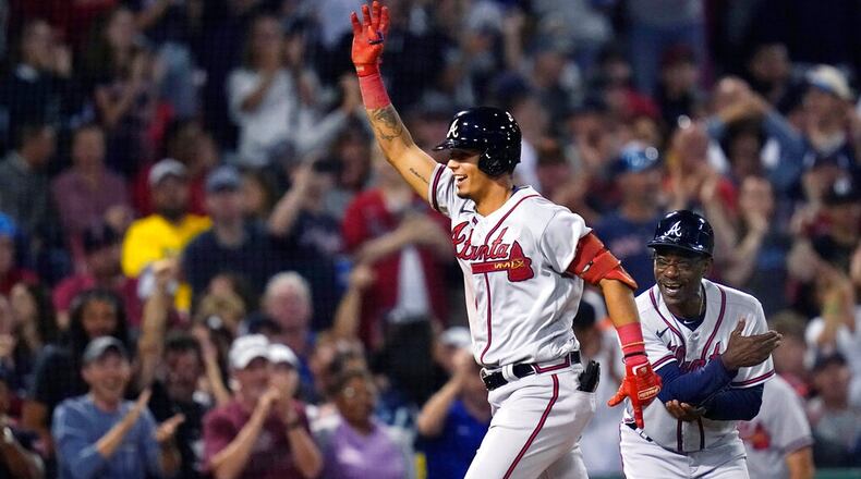 Atlanta Braves' Vaughn Grissom celebrates while running the bases on his two-run home run against the Boston Red Sox during the seventh inning of a baseball game Wednesday, Aug. 10, 2022, in Boston. At right is Braves third base coach Ron Washington. (AP Photo/Charles Krupa)