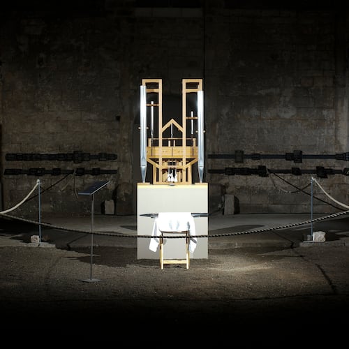 FILE - The organ of the John Cage organ project is illuminated prior to a 'sound change' at the Buchardi Church in Halberstadt, Germany, Sept. 5, 2020. (AP Photo/Markus Schreiber, File)