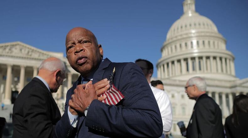 Rep. John Lewis (D-GA) thanks anti-gun violence supporters following a rally with fellow Democrats on the East Front steps of the U.S. House of Representatives October 4, 2017 in Washington, DC. The Democratic members of Congress held the rally to honor the victims of the mass shooting in Las Vegas and to demand passage of the bipartisan King-Thompson legislation to strengthen background checks and establishing a bipartisan Select Committee on Gun Violence. (Photo by Chip Somodevilla/Getty Images)