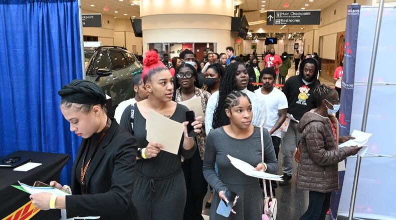 Job-seekers stroll through the domestic terminal atrium during the recent career fair at Hartsfield-Jackson Atlanta International Airport. Officials said there were more than 2,300 positions open, including managerial roles and jobs with airlines, cargo, maintenance, concessions and other companies that make ATL an industry leader. (Hyosub Shin / Hyosub.Shin@ajc.com)