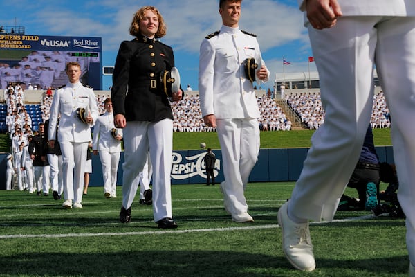 Members of the class of 2025 enter the U.S. Naval Academy for the academy's graduation and commissioning ceremony in Annapolis, Md.,Friday, May 23, 2025. (AP Photo/KT Kanazawich)