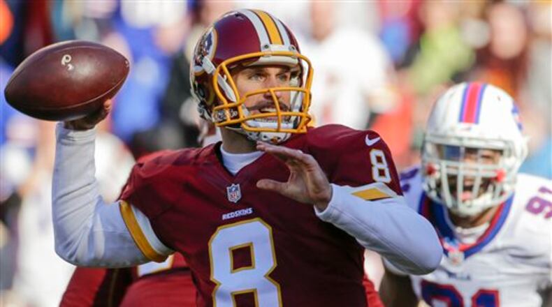 In this Dec. 20, 2015, photo, Washington Redskins quarterback Kirk Cousins (8) passes the ball during the first half of an NFL football game against the Buffalo Bills in Landover, Md. Forget about complicated playoff permutations. It's suddenly all become so simple for the Washington Redskins: Win their game against the Philadelphia Eagles next weekend, and coach Jay Gruden's club will clinch the NFC East title. (AP Photo/Mark Tenally)