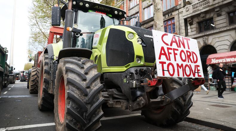 Tractors block O'Connell Street on the fifth day of the National Fuel Protest, in Dublin, Ireland, Saturday, April 11, 2026. (AP Photo/Peter Morrison)