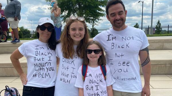 Lawrenceville residents Kelly Gitaitis, her daughters, Selah, 16, and Gabby, 8, and husband, Greggory, attended a Monday, June 1, 2020 rally by OneRace in downtown Atlanta to show their support for efforts to improve race relations in the wake of national unrest, including in Atlanta, over racially-charged killings of African Americans. ERIC STIRGUS / ESTIRGUS@AJC.COM