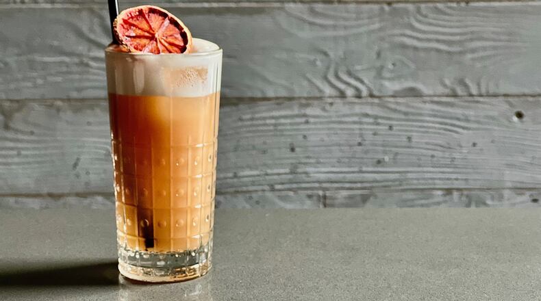 A vigorous shake gives Foundation Social's riff on a Ramos Gin Fizz a creamy head with citrus flavors and aromas. /
Courtesy of Foundation Social Eatery