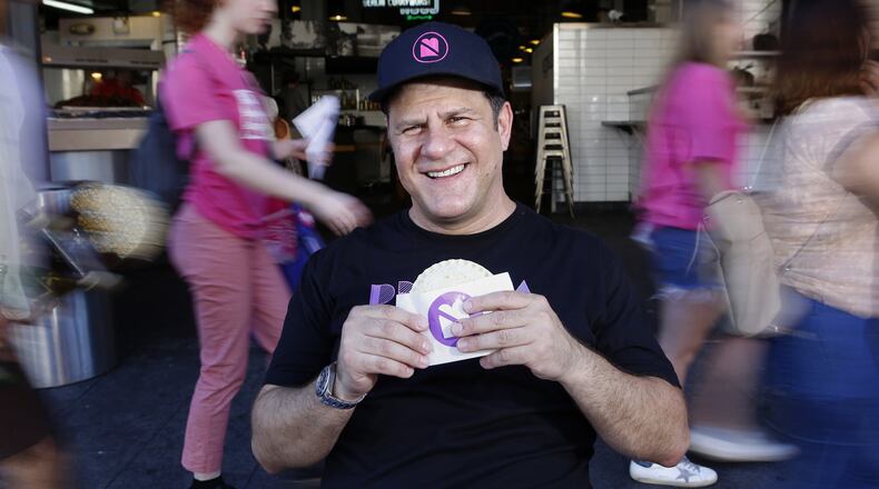 Umami Burger founder Adam Fleischman, with a peanut butter and jelly sandwich, at Grand Central Market in Los Angeles, Calif. (Christian K. Lee/Los Angeles Times/TNS)
