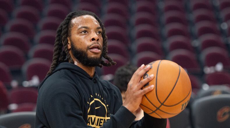 Cleveland Cavaliers' Darius Garland warms up before the start of an NBA basketball game against the Philadelphia 76ers in Cleveland, Wednesday, Nov. 5, 2025. (AP Photo/Phil Long)