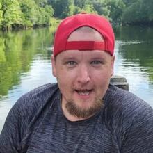 Casey Plumb was found dead with several gunshot wounds on a Kennesaw road Thursday morning, police said. An arrest has been made in the case.