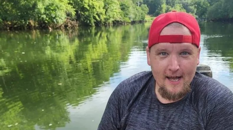 Casey Plumb was found dead with several gunshot wounds on a Kennesaw road Thursday morning, police said. An arrest has been made in the case.