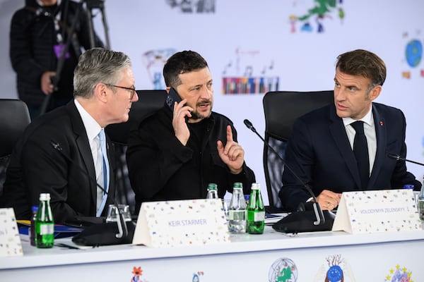 Britain's Prime Minister Keir Starmer, left, Ukraine's President Volodymyr Zelenskyy and France's President Emmanuel Macron, right, attend a plenary meeting at the beginning of a summit where the leaders of 47 European countries and organizations will discuss security, defense and democratic standards, in Tirana, Albania, Friday, May 16, 2025. (Leon Neal/Pool via AP)