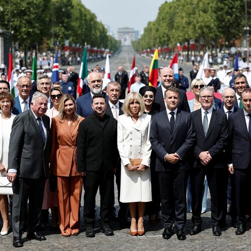 French President Emmanuel Macron, his wife Brigitte Macron, Ukraine's President Volodymyr Zelenskyy and his wife Olena Zelenska, Heads of State and Government of the Coalition of the Willing, President of the National Assembly Yael Braun-Pivet, and President of the Senate Gerard Larcher pose for a family photo after the annual Bastille Day military parade on the Place de la Concorde in Paris, France, Tuesday, July 14, 2026. (Benoit Tessier/Pool photo via AP)