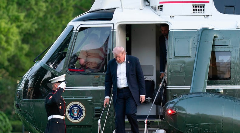 President Donald Trump steps off from Marine One upon his arrival at the South Lawn of the White House, Sunday, May 3, 2026, in Washington. (AP Photo/Jose Luis Magana)