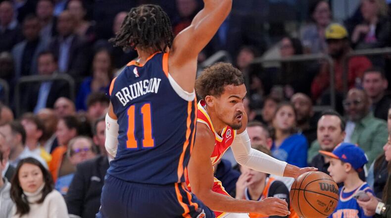 Atlanta Hawks guard Trae Young drives against New York Knicks guard Jalen Brunson (11) during the first half of an NBA basketball game Wednesday, Nov. 2, 2022, at Madison Square Garden in New York. (AP Photo/Mary Altaffer)