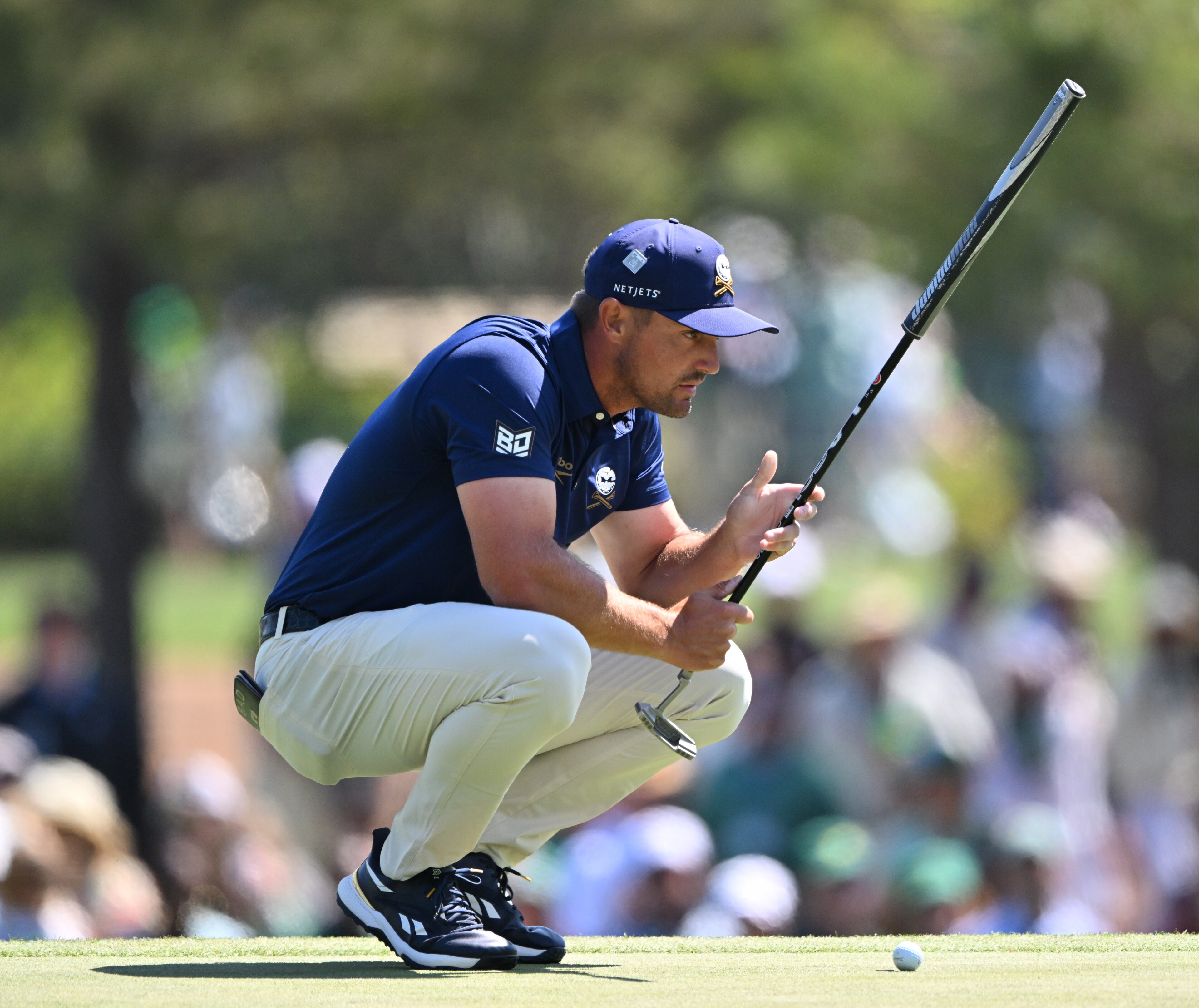Bryson DeChambeau lines up putt on third hole during final round of the Masters golf tournament, at Augusta National Golf Club, Saturday, April 13, 2025, in Augusta, Ga. (Hyosub Shin / AJC)