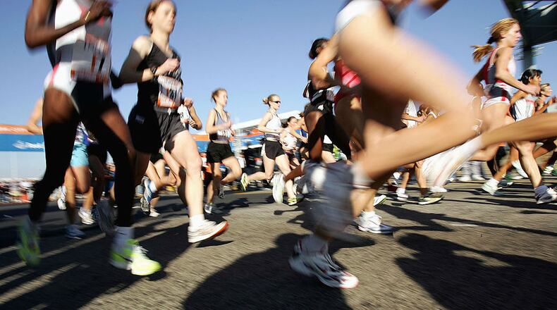 Runners stream over the Verrazano Narrows Bridge at the start of the 2004 New York City Marathon.